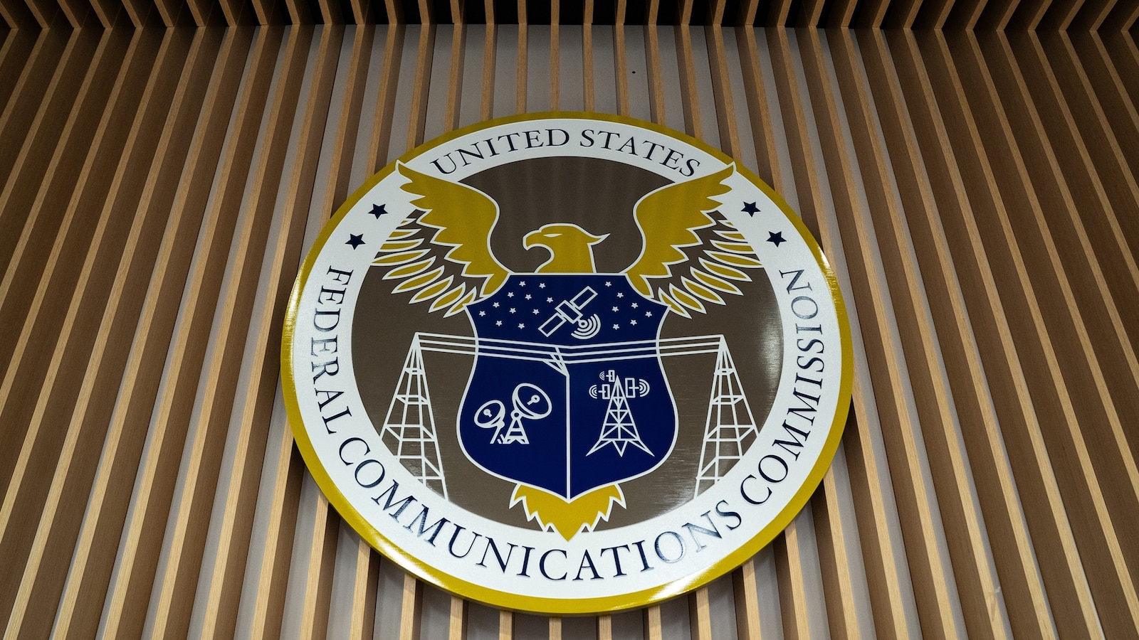 The seal of the Federal Communications Commission (FCC) prior to an open commission meeting at the agency's headquarters in Washington, Feb. 18, 2026. 