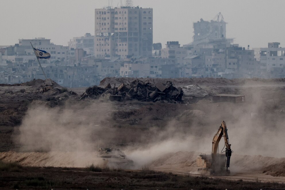 PHOTO: An Israeli tank manoeuvres in Gaza as seen from the Israeli side of the border