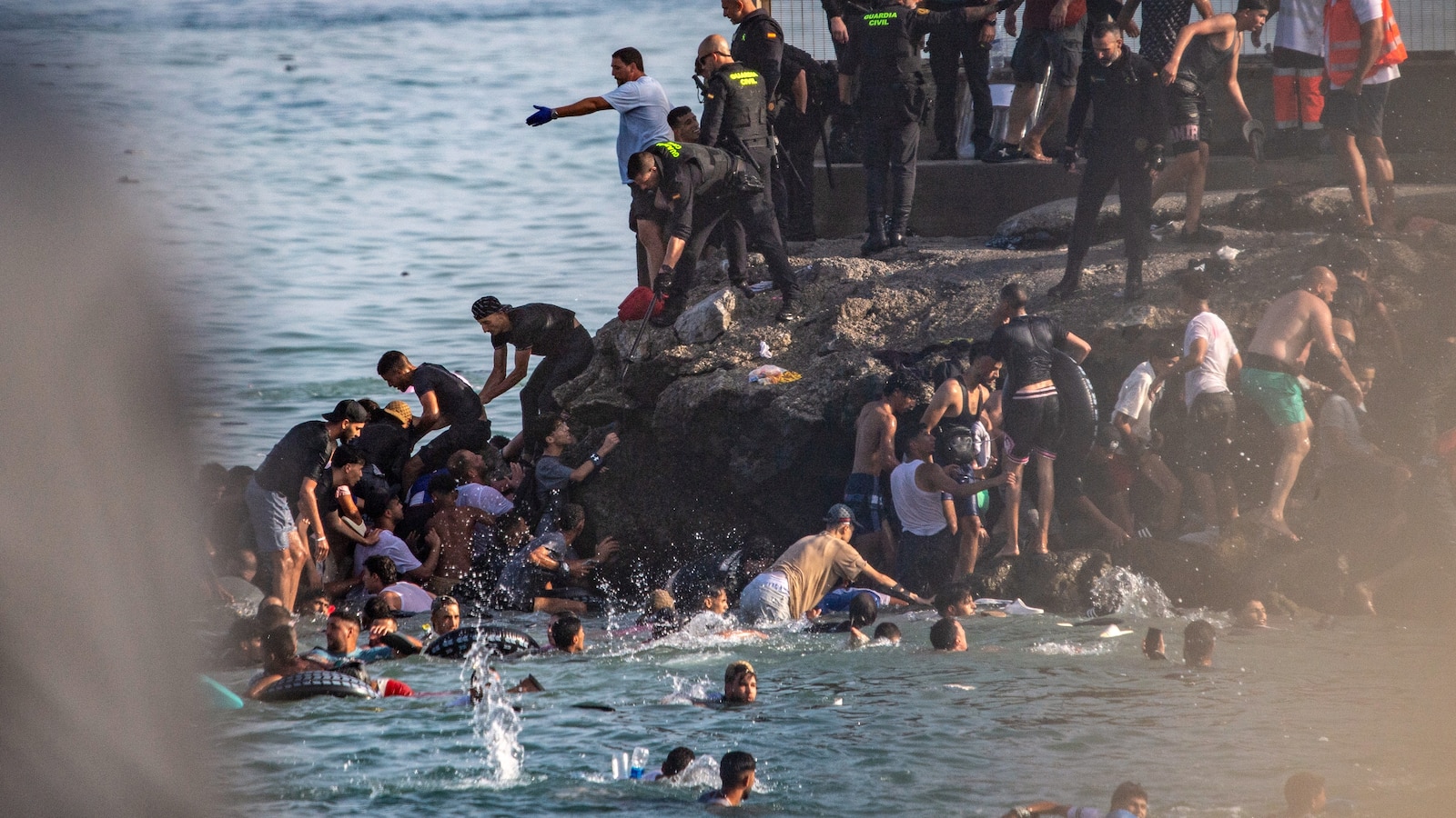 Spain deploys military to Ceuta after thousands of people breach Morocco’s border and at least 9 die
