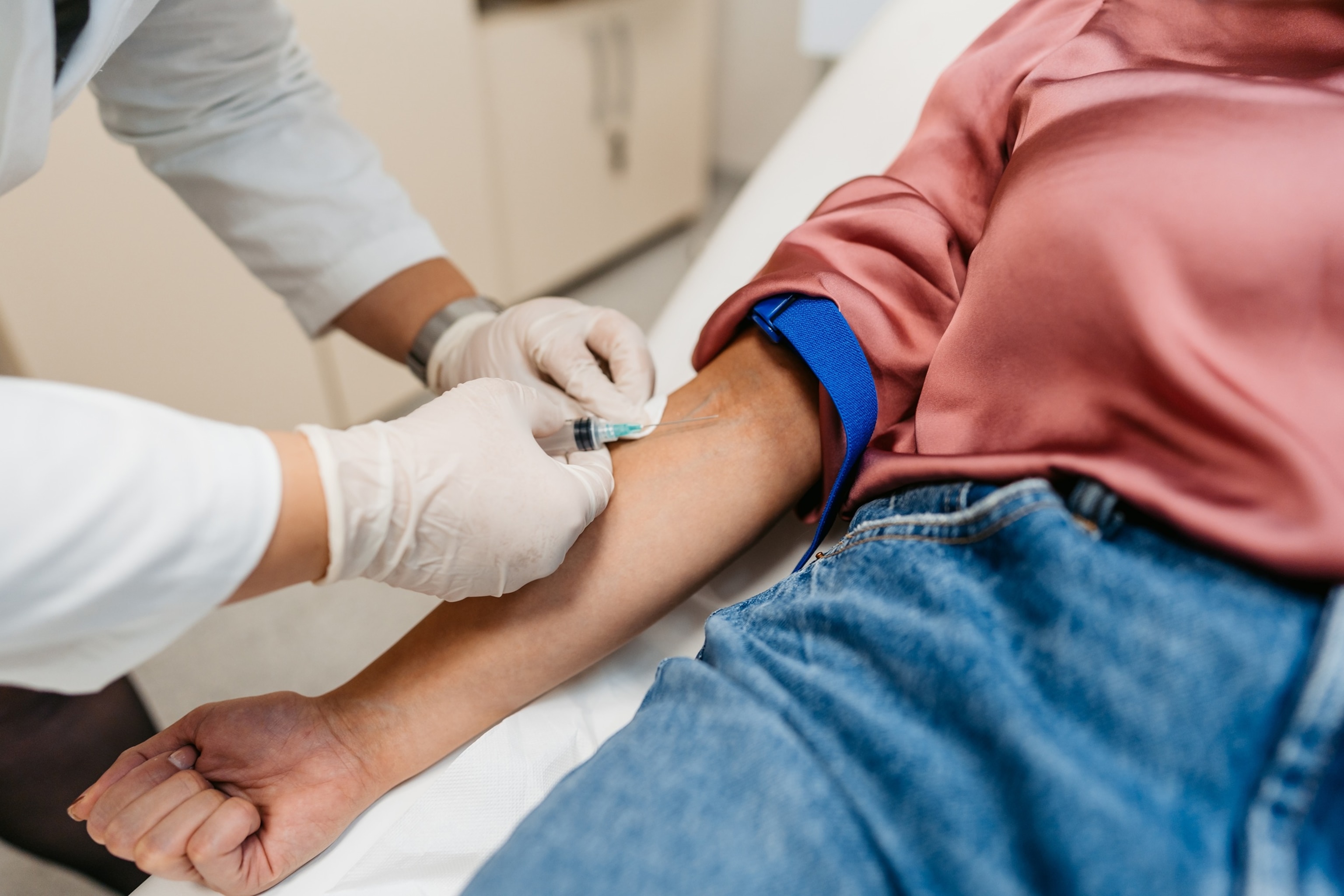 PHOTO: Doctor Taking Blood Samples From A Female Patient