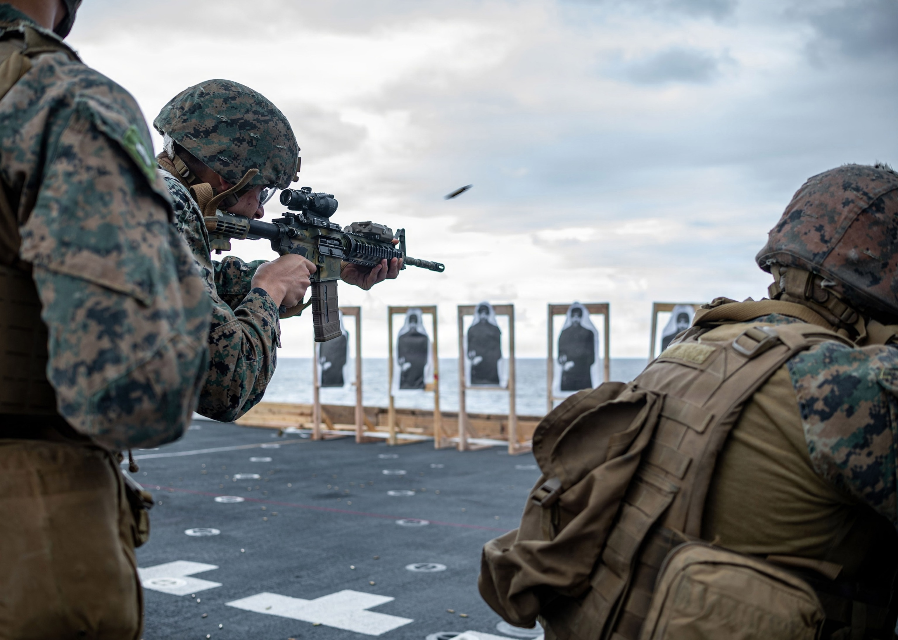 PHOTO: U.S. Marines, with the 31st Marine Expeditionary Unit (MEU), conduct a live fire evolution on the flight deck of San Antonio-class amphibious transport dock ship USS New Orleans (LPD 18), while underway, Feb. 11, 2026.