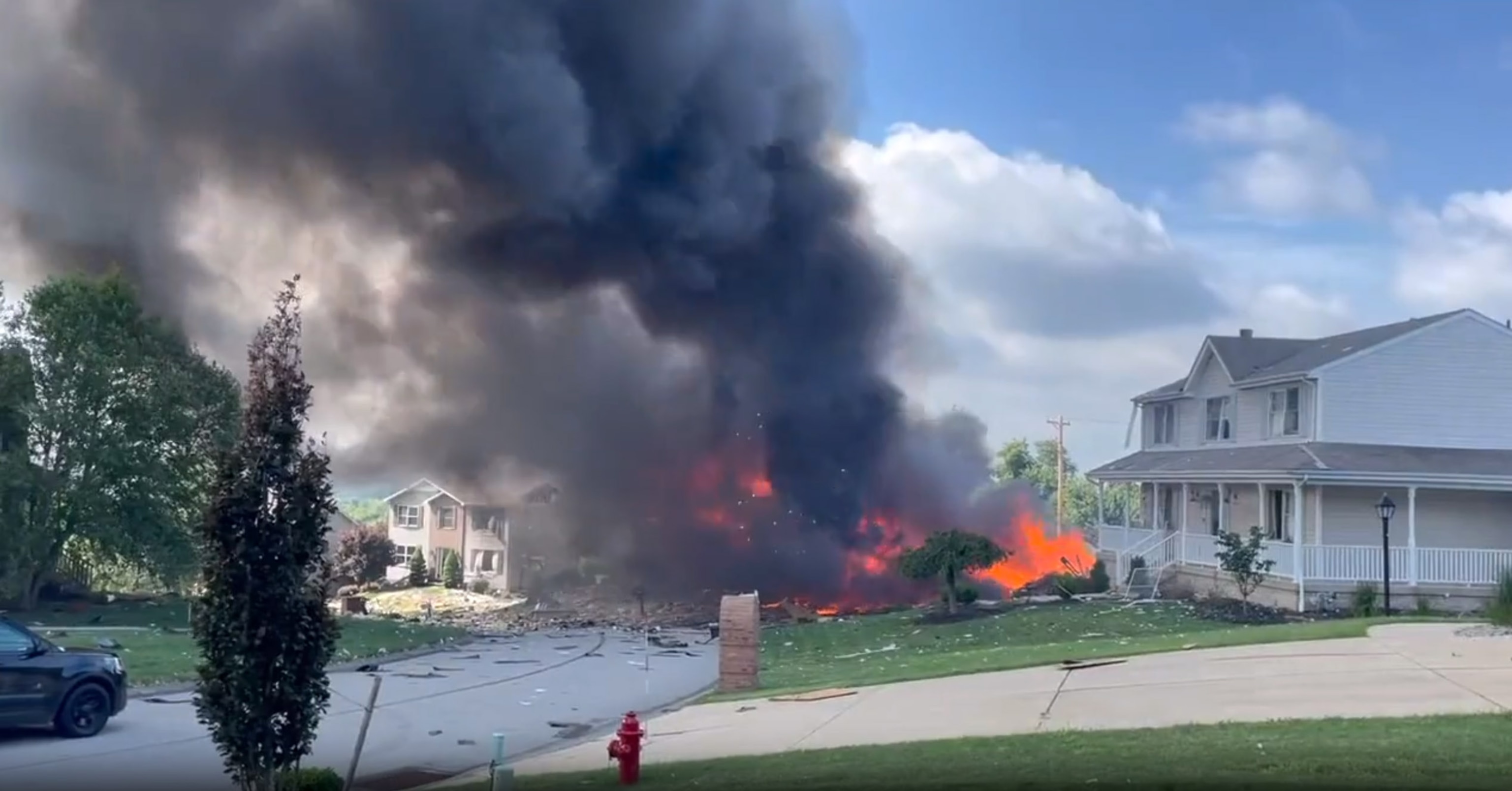 PHOTO: Fire continues to burn after a house explosion in Plum, Pa., on Aug. 12, 2023.