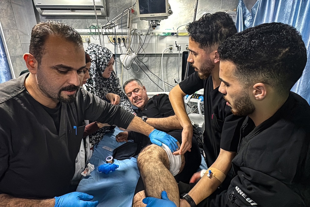 PHOTO: Hussam Abu Safiya, director of the Kamal Adwan Hospital, is treated by colleagues for his injuries following an Israeli strike that hit the medical compound in Beit Lahia in the northern Gaza Strip, Nov. 23, 2024.