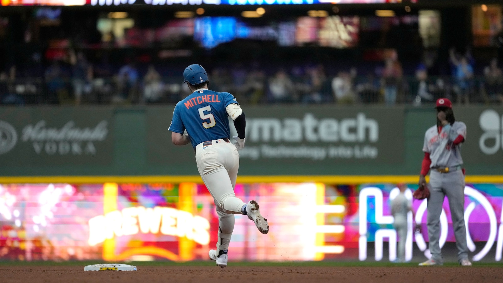 Garrett Mitchell hits grand slam and MLB-best Brewers pound Reds 20-0 to clinch playoff spot