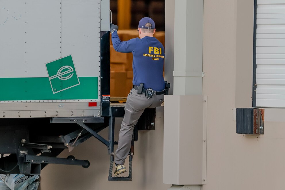 PHOTO: A member of an FBI Evidence Response Team helps load a truck with 2020 election ballots at the Fulton County Department of Registration and Elections Hub and Operation Center in Union City, Ga., January 28, 2026. 