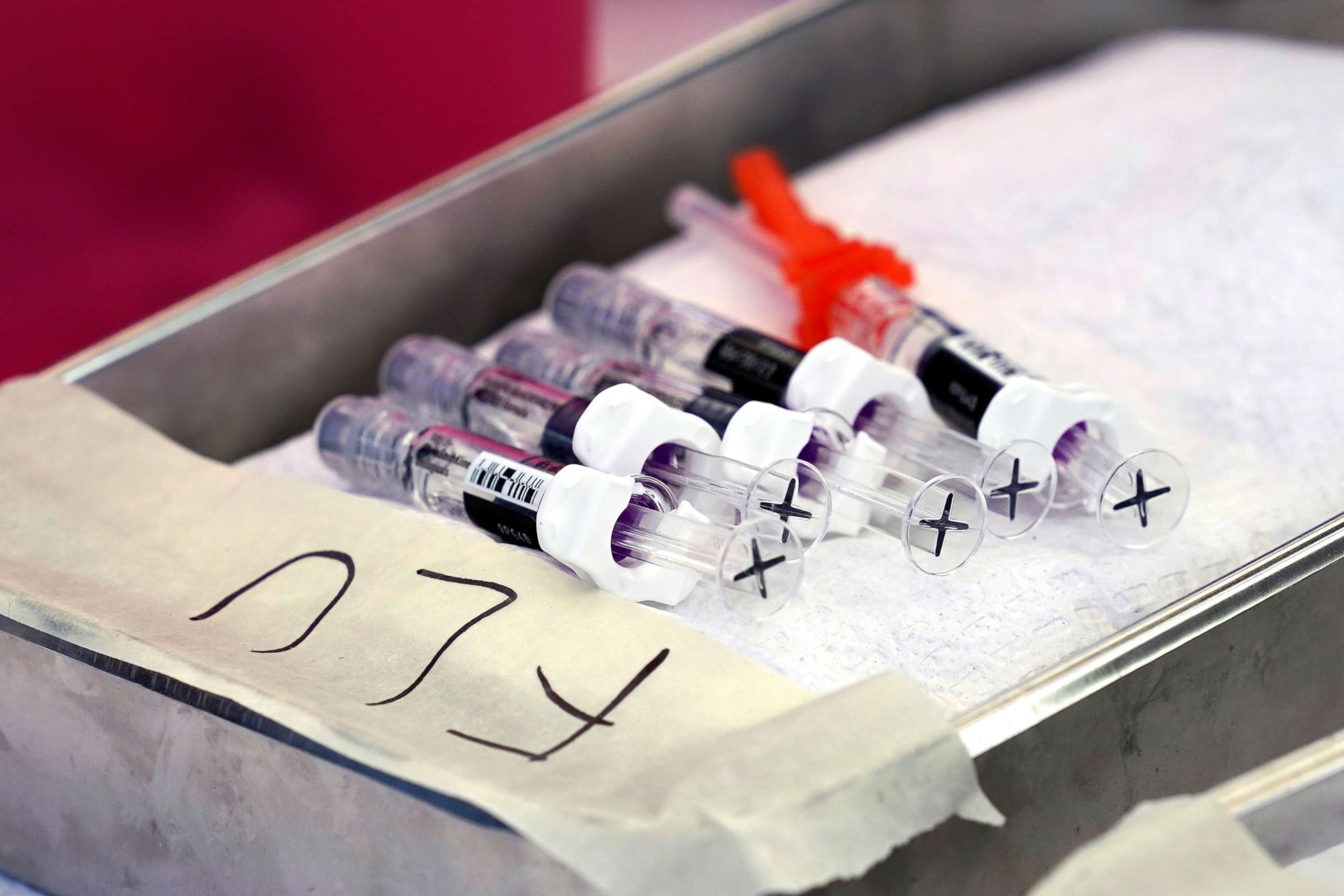 PHOTO: Several flu vaccines are lined up in a pan at the Blue Shield of California Promise Health Plans' Community Resource Center, Oct. 28, 2022, in Lakewood.