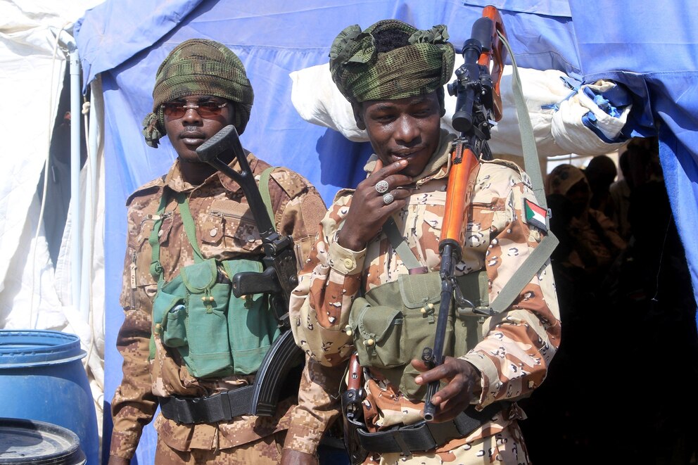 PHOTO: Security stand by during a visit by the Darfur Regional Governor and leader of the Sudan Liberation Movement (SLM) at the Al-Afad camp for displaced people in the town of Al-Dabba, northern Sudan, on Nov. 26, 2025