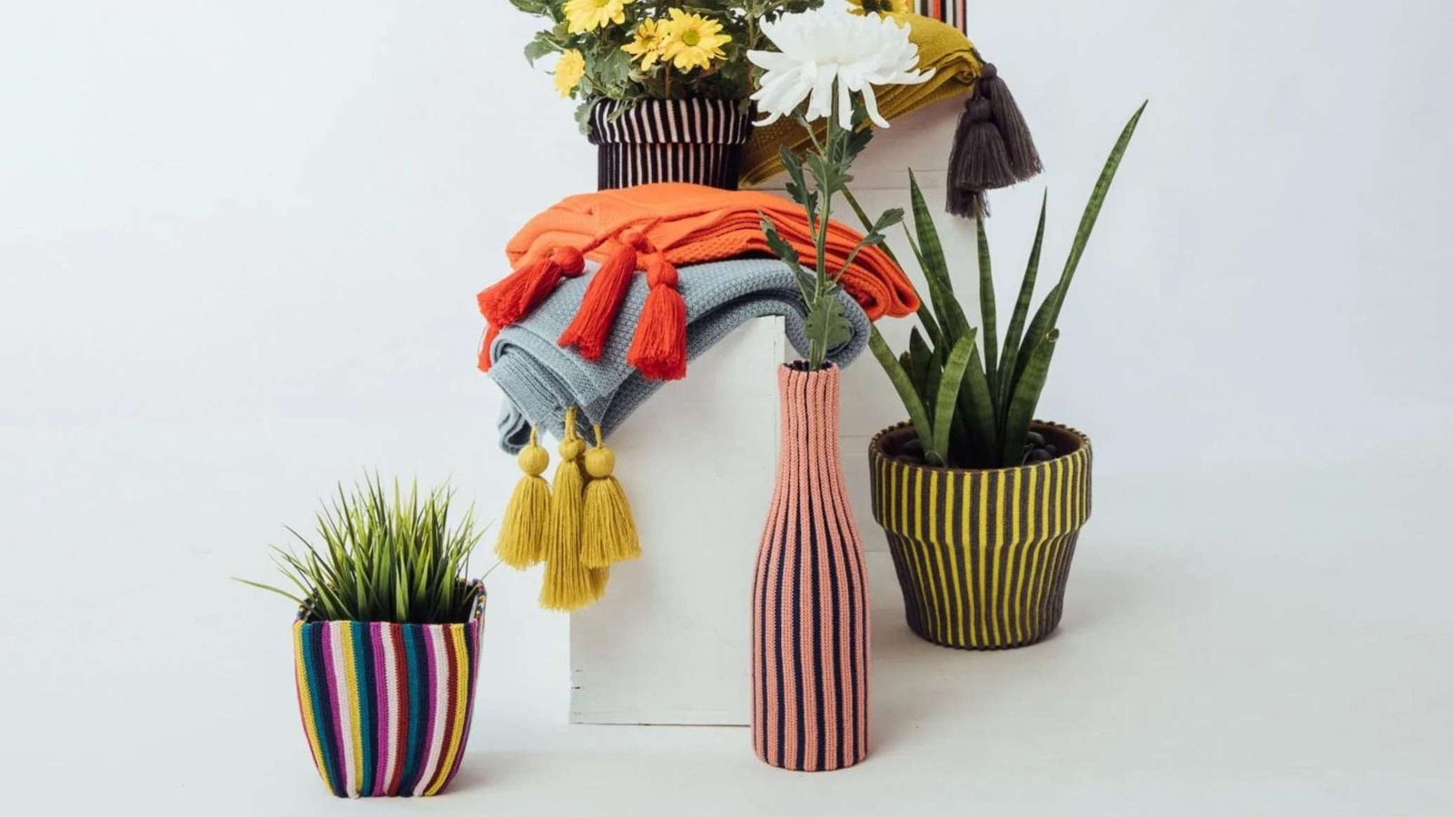 Made with remnant acrylic yarn, the vertical stripes use strands too short for conventional knitting, but too good to waste.