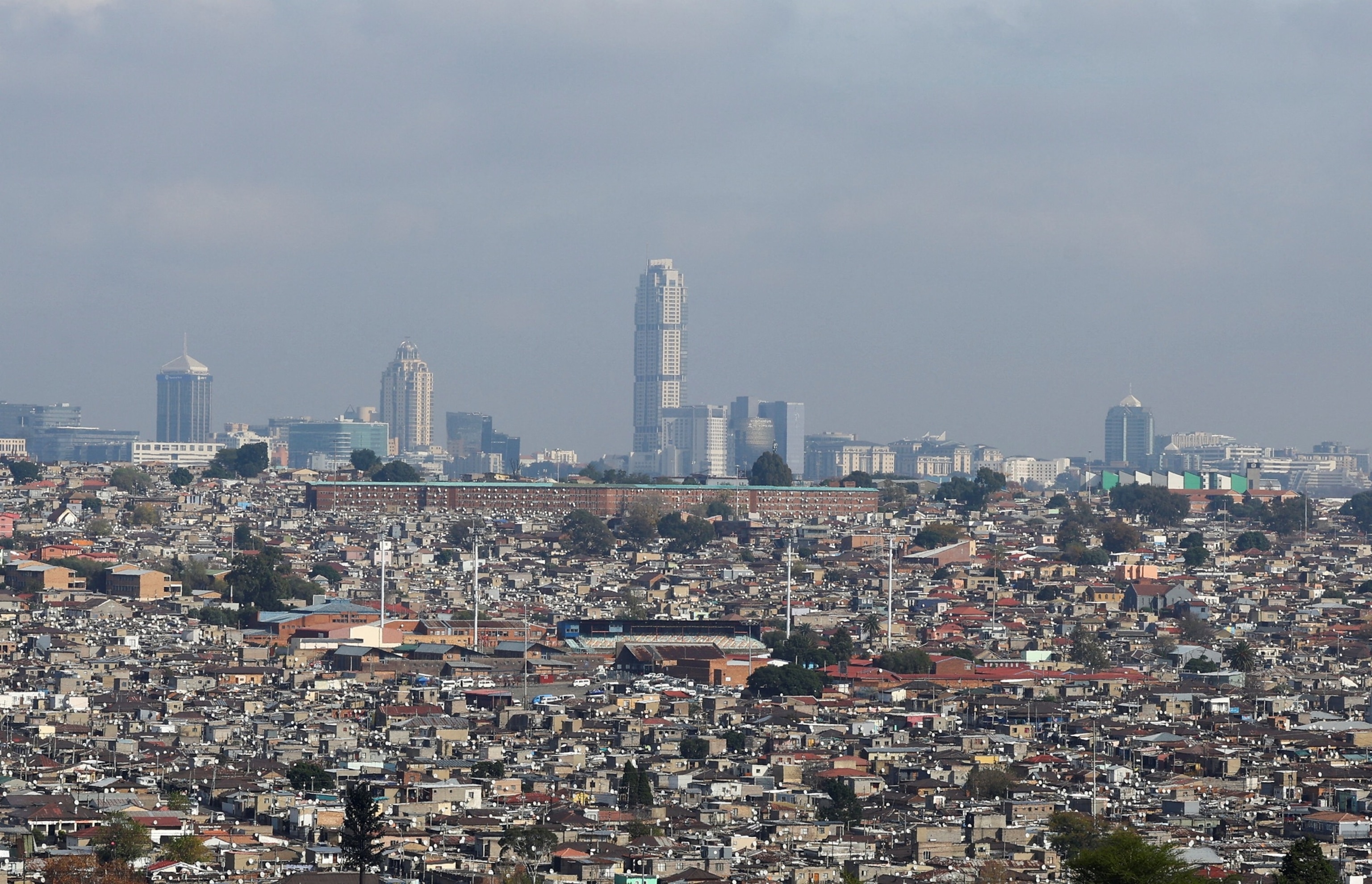 PHOTO: A general view of densely packed residential housing in Alexandra township in the foreground and the Sandton central business district, Johannesburg's financial district in the background, in Johannesburg, South Africa, May 21, 2026.