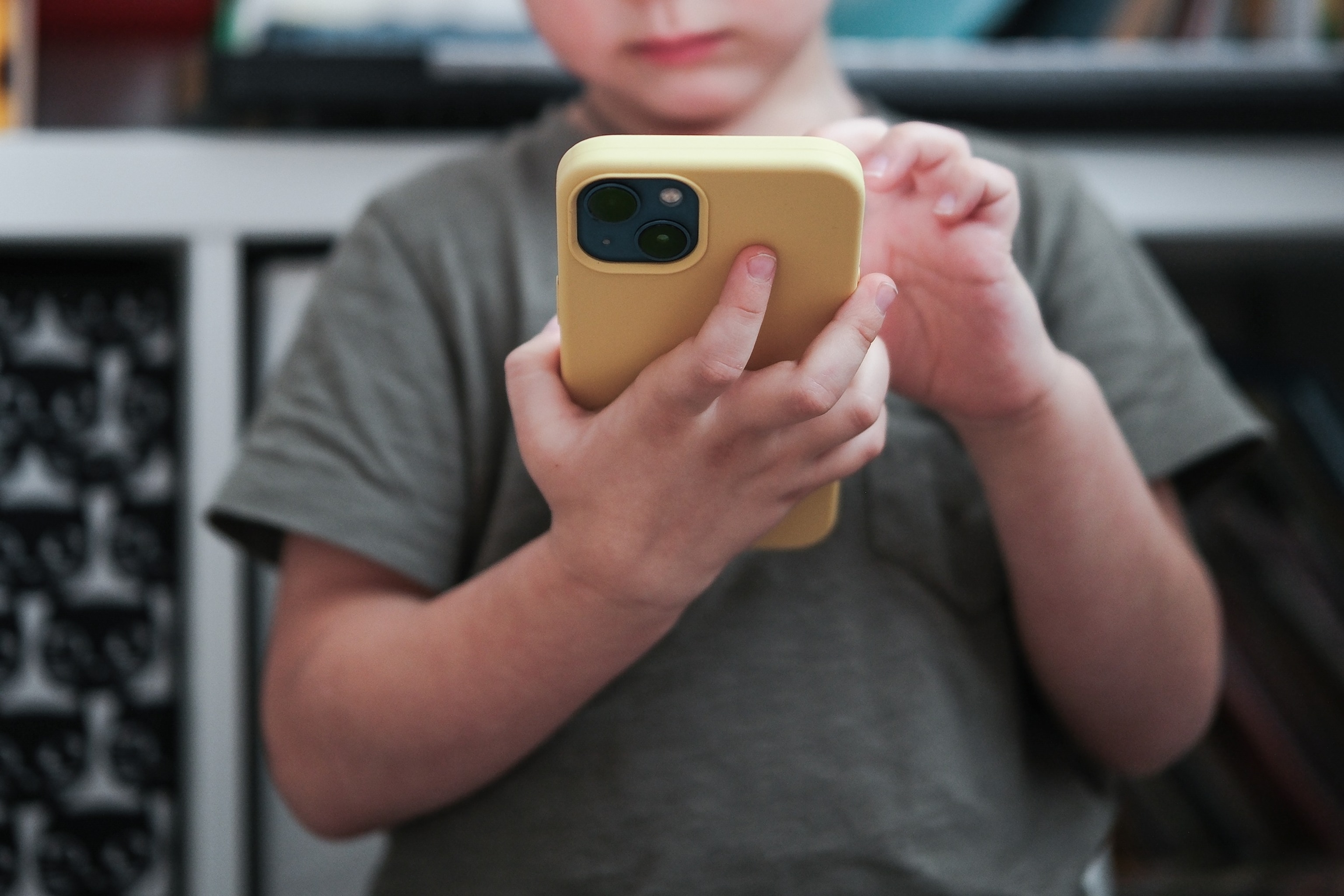 PHOTO: A small child plays on a smartphone in an undated stock photo.