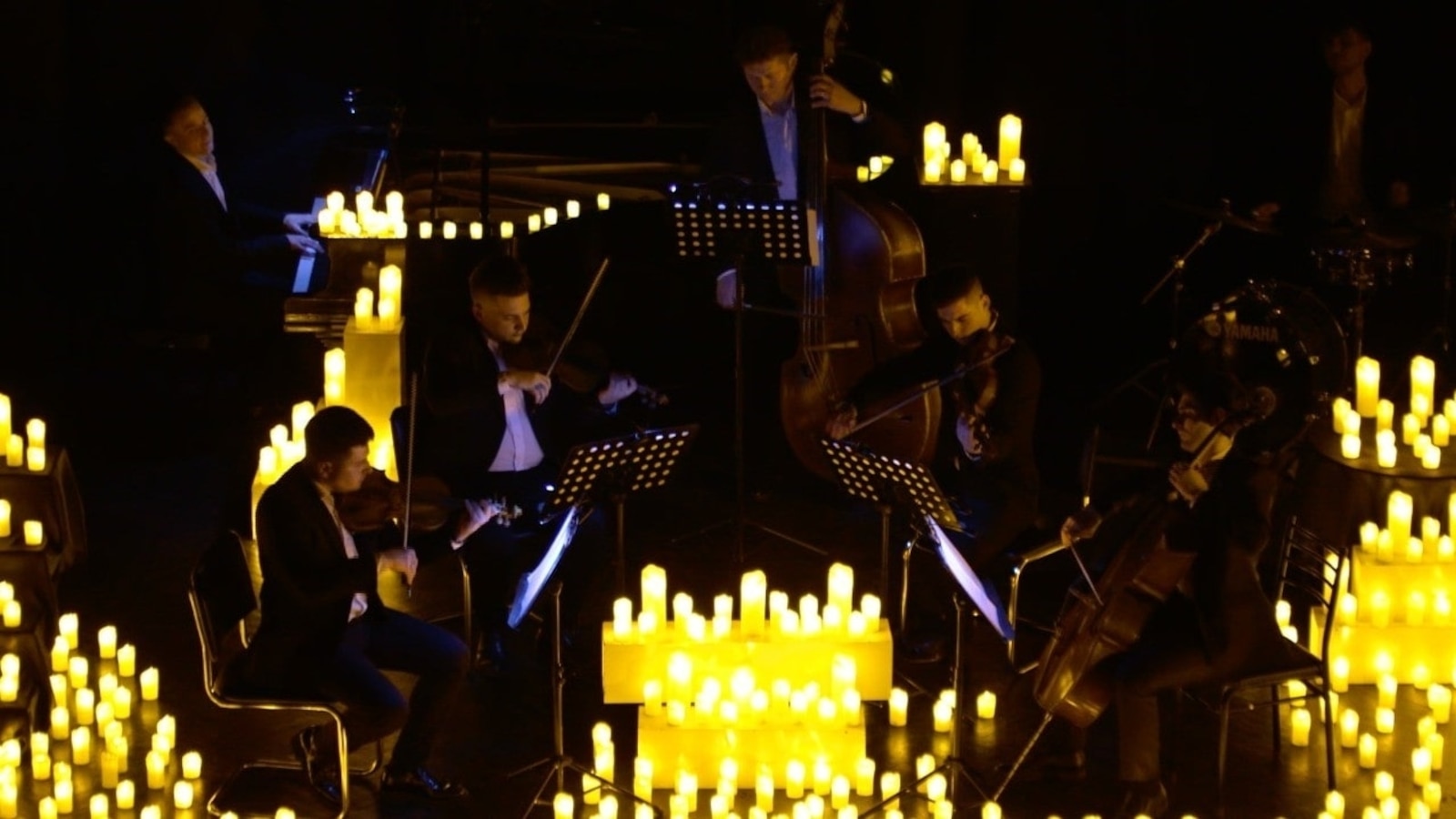 With candles and flashlights, Ukrainians maintain daily routines despite blackouts caused by