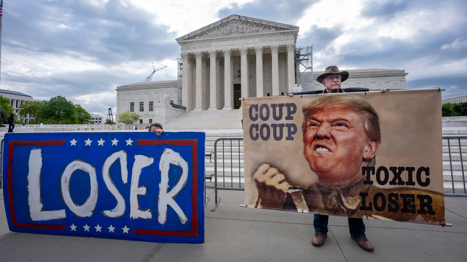  The Latest: Trump takes to social media before Supreme Court arguments