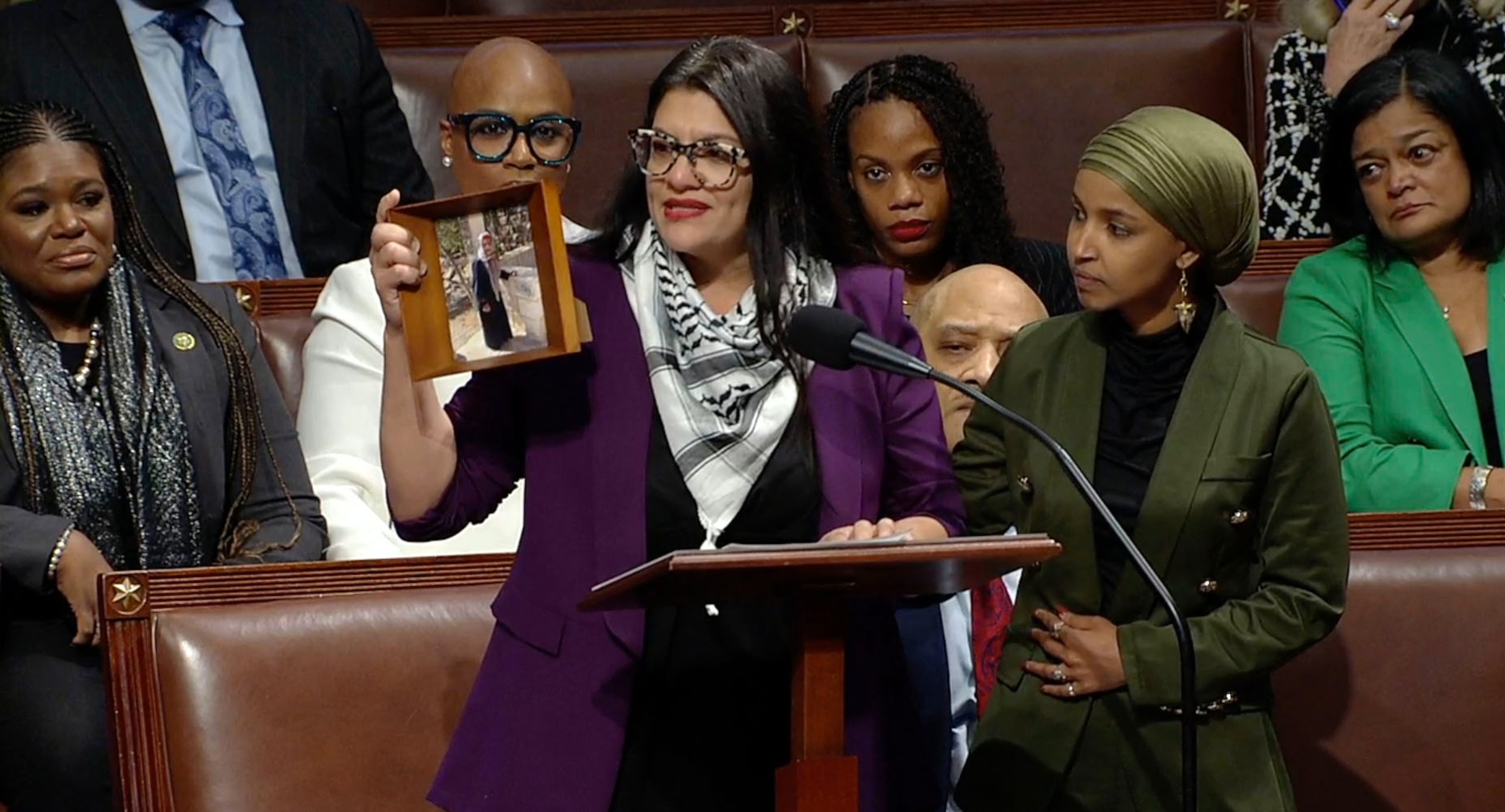 PHOTO: Rep. Rashida Tlaib holds up a photo of her grandmother as she speaks on the House floor on Nov. 7, 2023, in Washington, D.C.