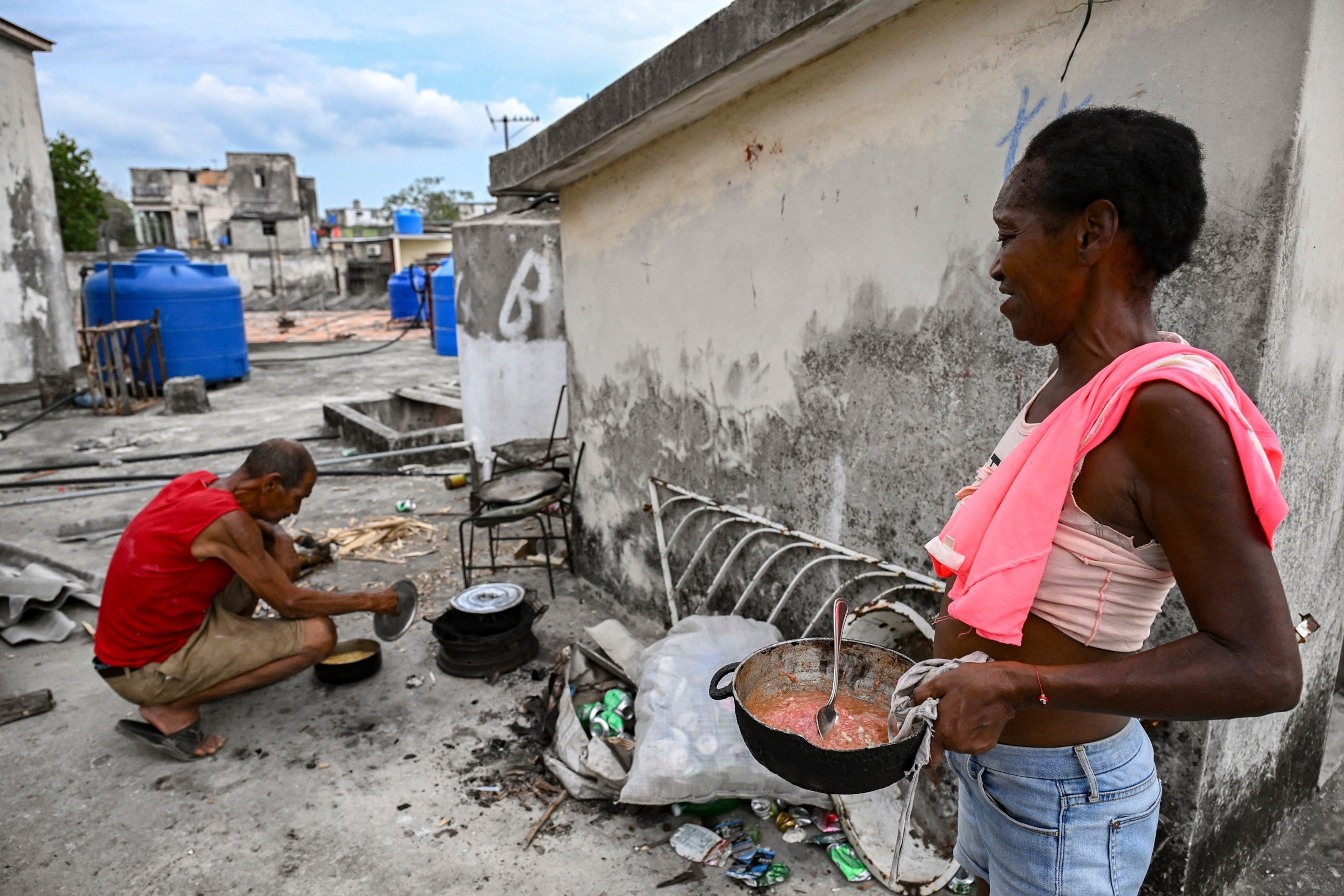 PHOTO: People cook with firewood during a blackout in Havana on May 13, 2026. 