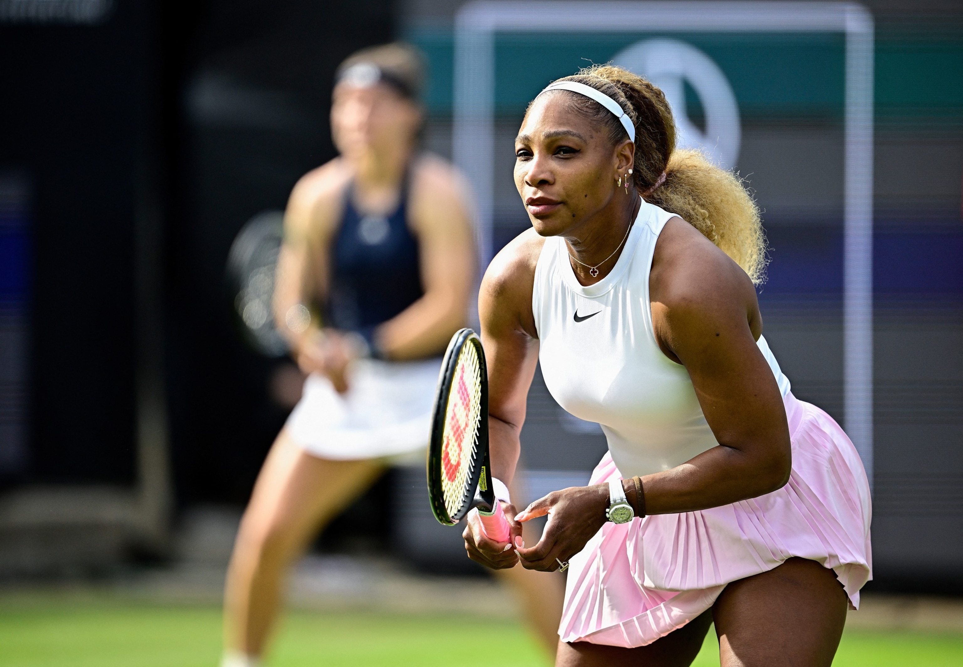 PHOTO: US tennis player Serena Williams (R) and Czech Republic's Karolina Muchova play against New Zealand's Erin Routliffe and Mexico's Giuliana Olmos during the women's doubles round of 16 match at the WTA500 Berlin Tennis Open tournament in Berlin.