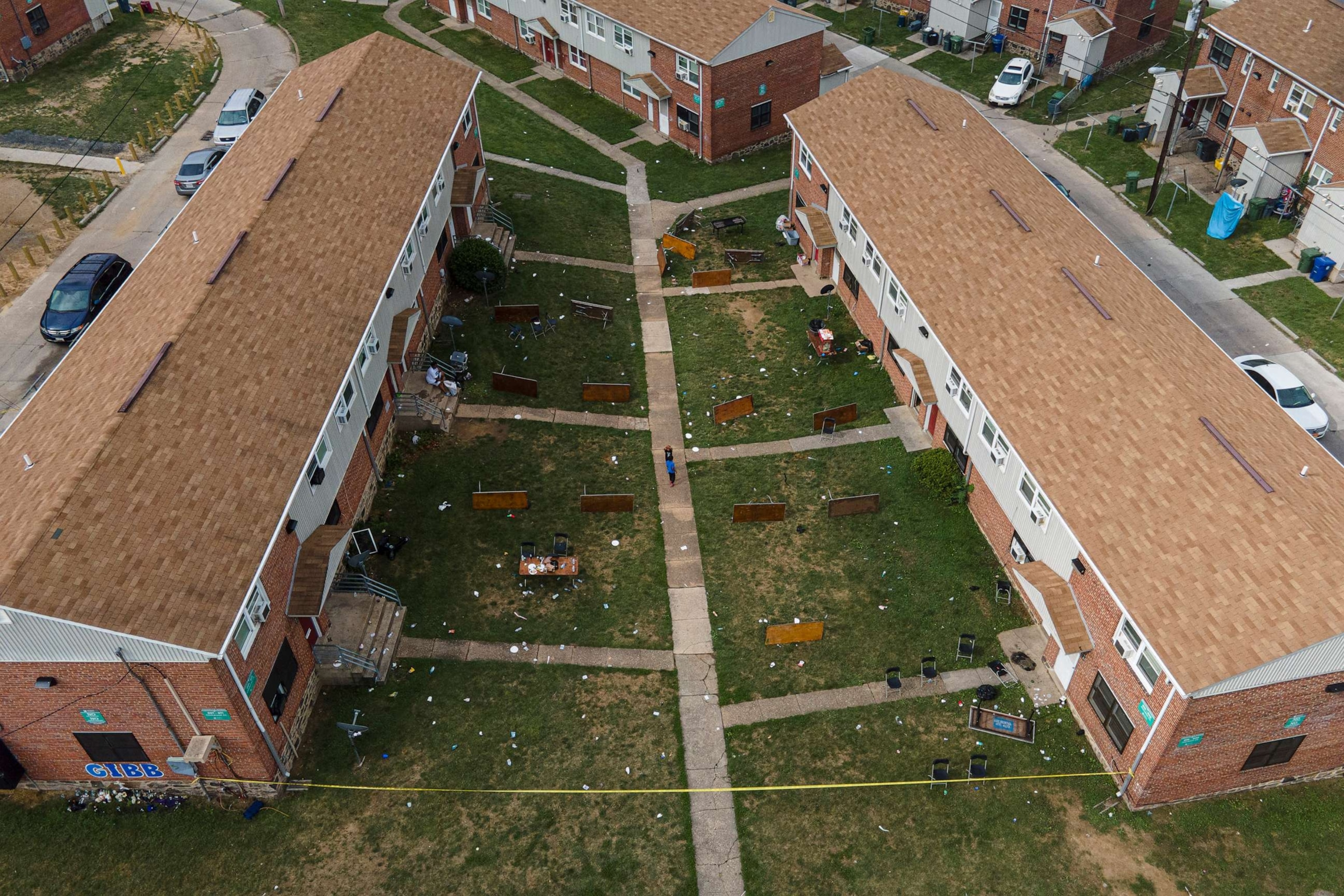 PHOTO: Tables are left on their side in the area of a mass shooting incident in the Southern District of Baltimore, July 2, 2023.