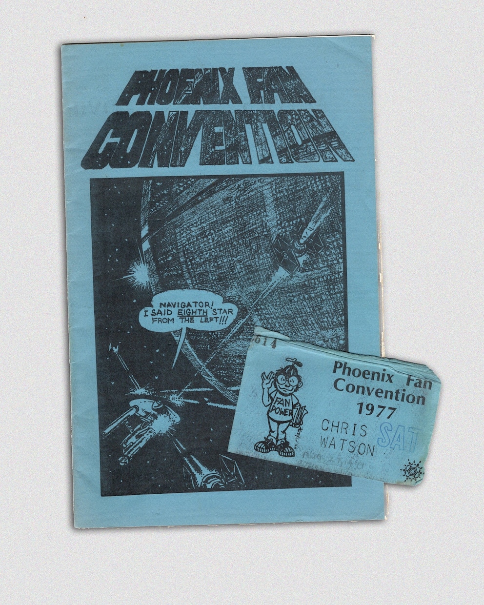 Program for the Phoenix Fan Convention, held in August 1977 on Phoenix, Arizona, with the author's convention nametag. 