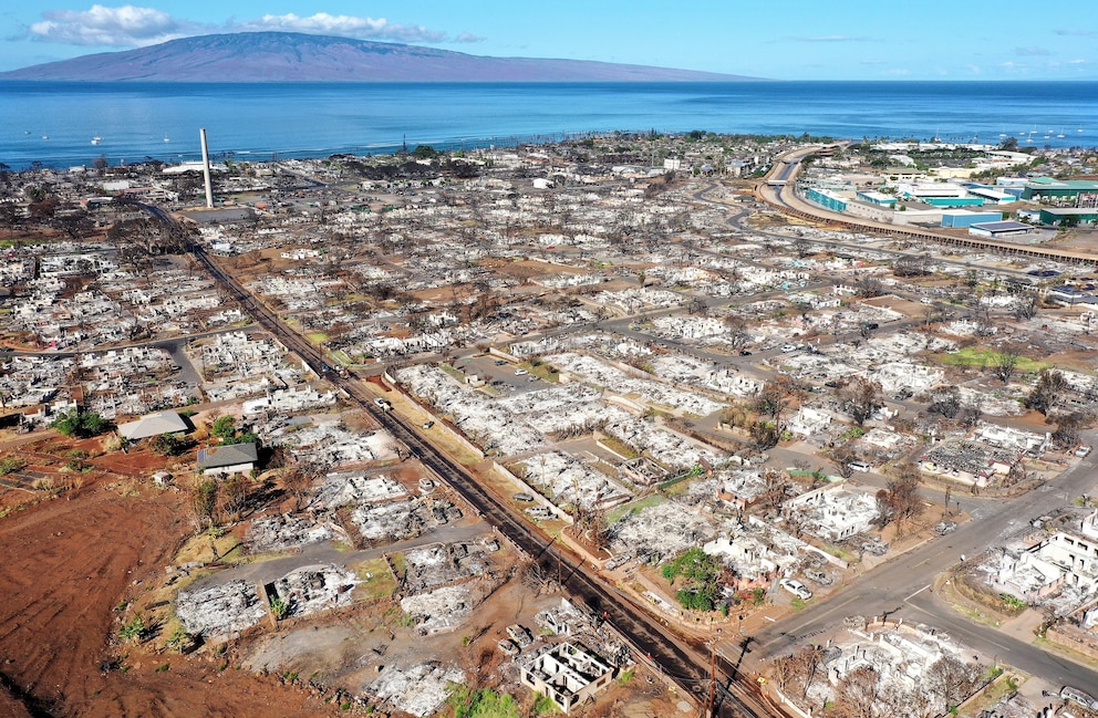 PHOTO: In an aerial view, burned structures and cars are seen nearly two months after a devastating wildfire, on Oct. 7, 2023, in Lahaina, Hawaii.