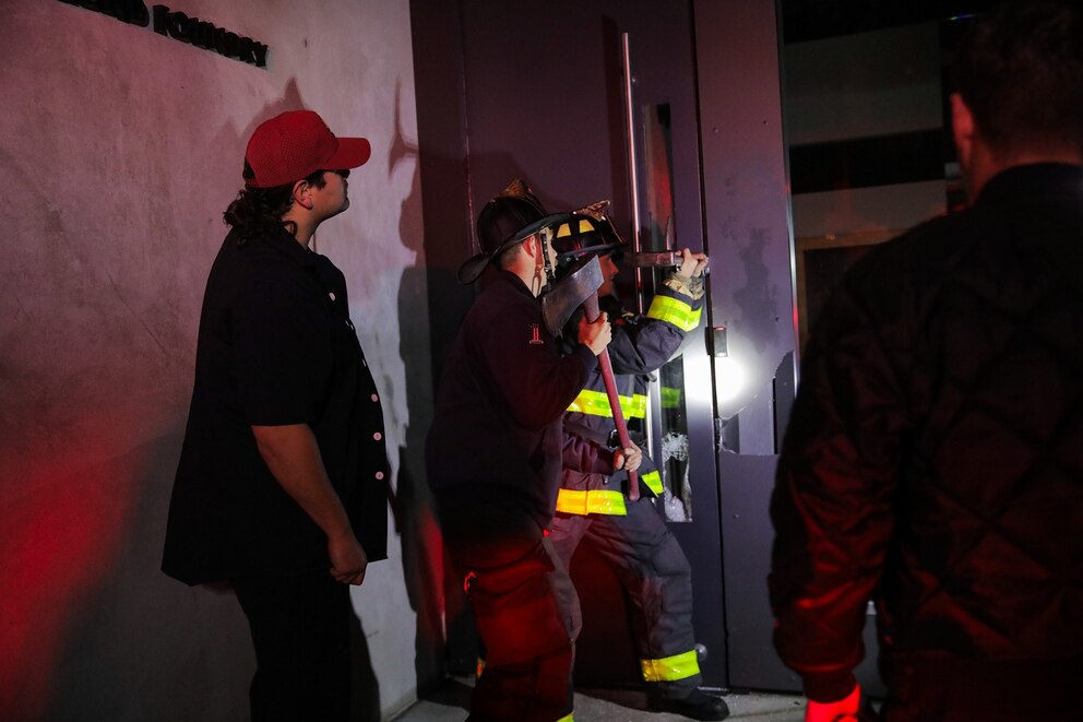 San Francisco firefighters break open a to rescue employees stuck inside a store due to the power outage in San Francisco on Saturday, Dec. 20, 2025.