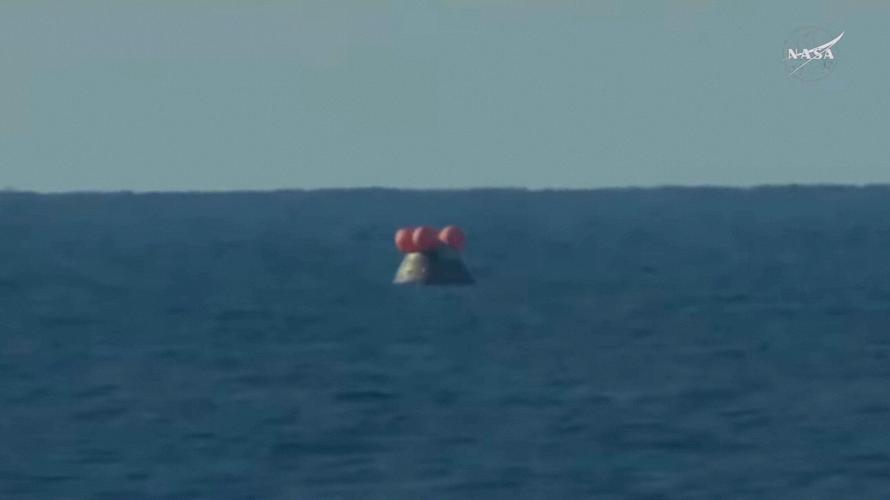 Artemis II live updates: Crew splashes down in Pacific Ocean after ...