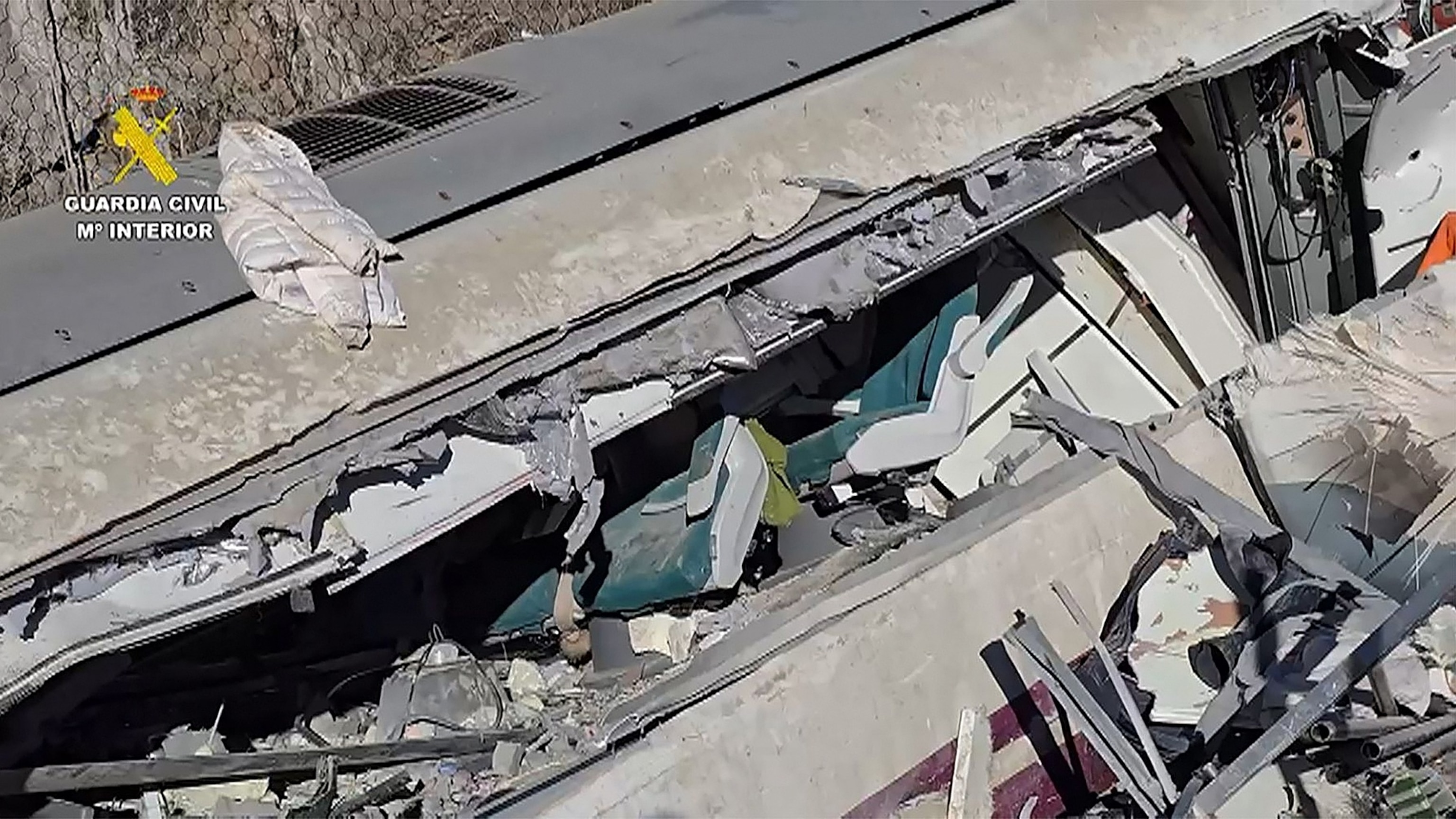 PHOTO: A crushed train car is seen Jan. 19, 2026 at the site of the wreckage where a high-speed train carrying more than 300 passengers derailed and collided with another train near the town of Adamuz, Cordoba, Spain.