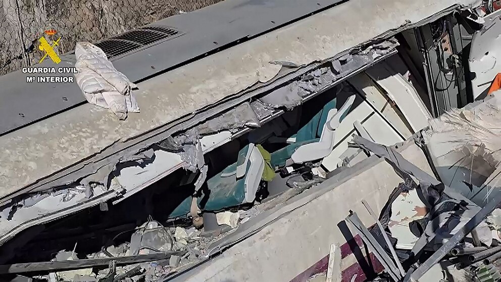 PHOTO: A crushed train car is seen Jan. 19, 2026 at the site of the wreckage where a high-speed train carrying more than 300 passengers derailed and collided with another train near the town of Adamuz, Cordoba, Spain.