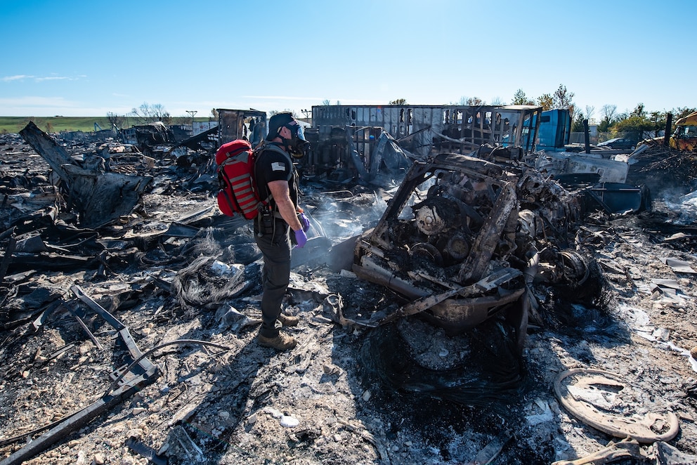 In this photo provided by the U.S. Air National Guard, members of the Kentucky National Guard's 41st Civil Support Team survey the site of a fatal airplane crash in Louisville, Ky., on Wednesday, Nov. 5, 2025.