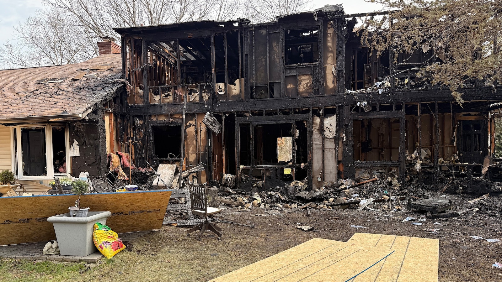 A Long Island teen spotted a neighbor's house fire while waiting for his school bus, prompting a 911 call.