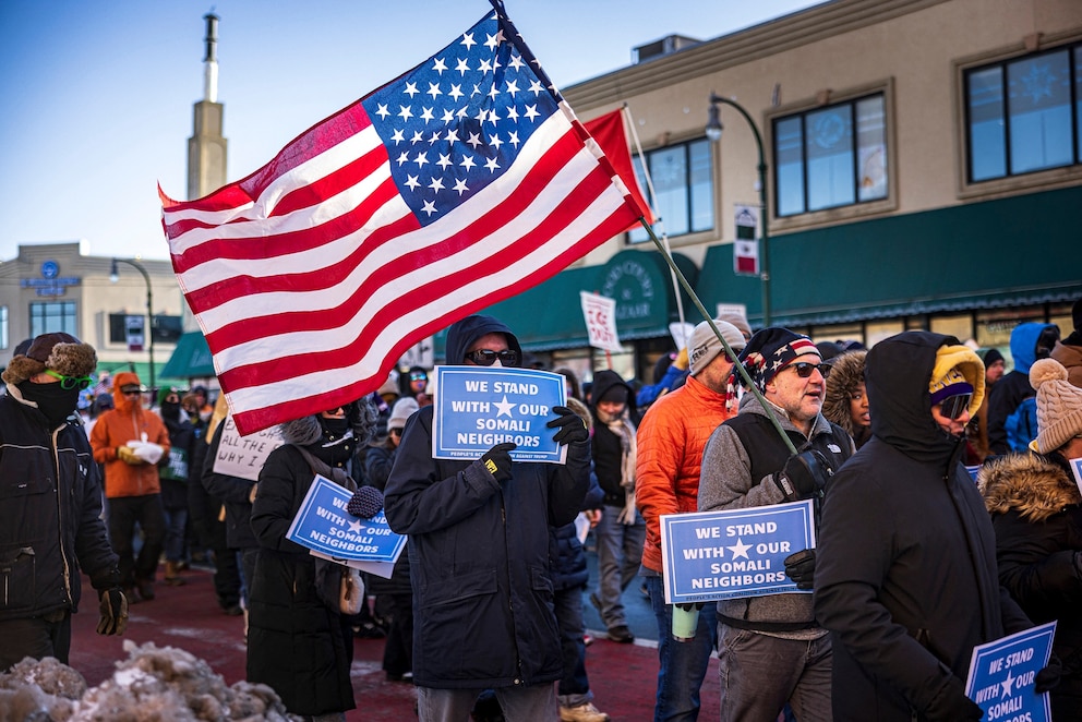 PHOTO: Protesters march through frigid conditions, with temperatures near 10 degrees Fahrenheit (minus 12 Celsius), in a neighborhood in Minneapolis, Minnesota, on Dec. 20, 2025.