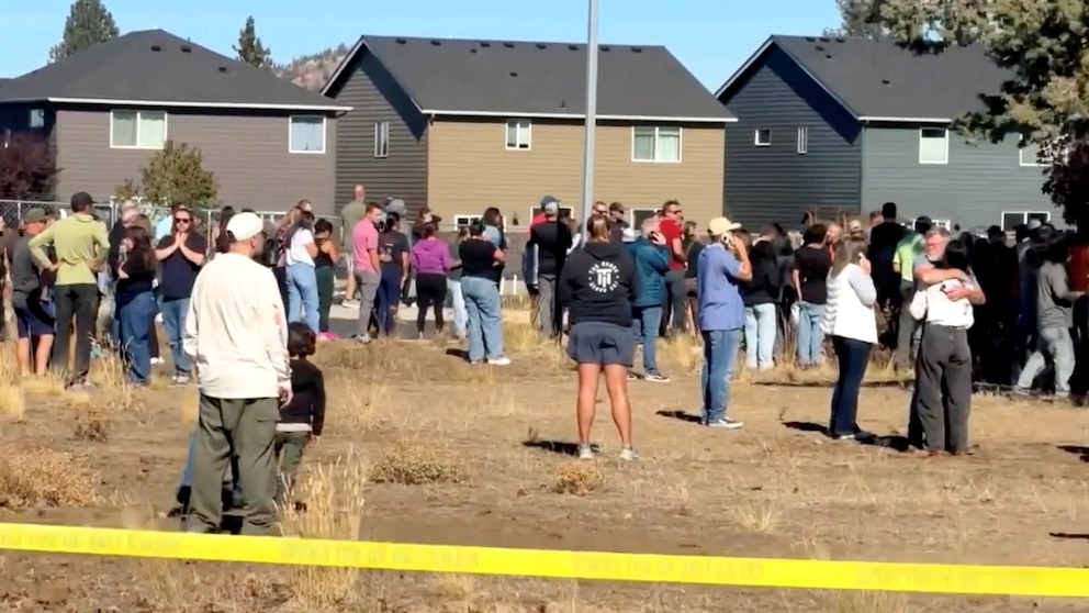 PHOTO: People react at the scene of a shooting at Silver Rail Elementary School in Bend