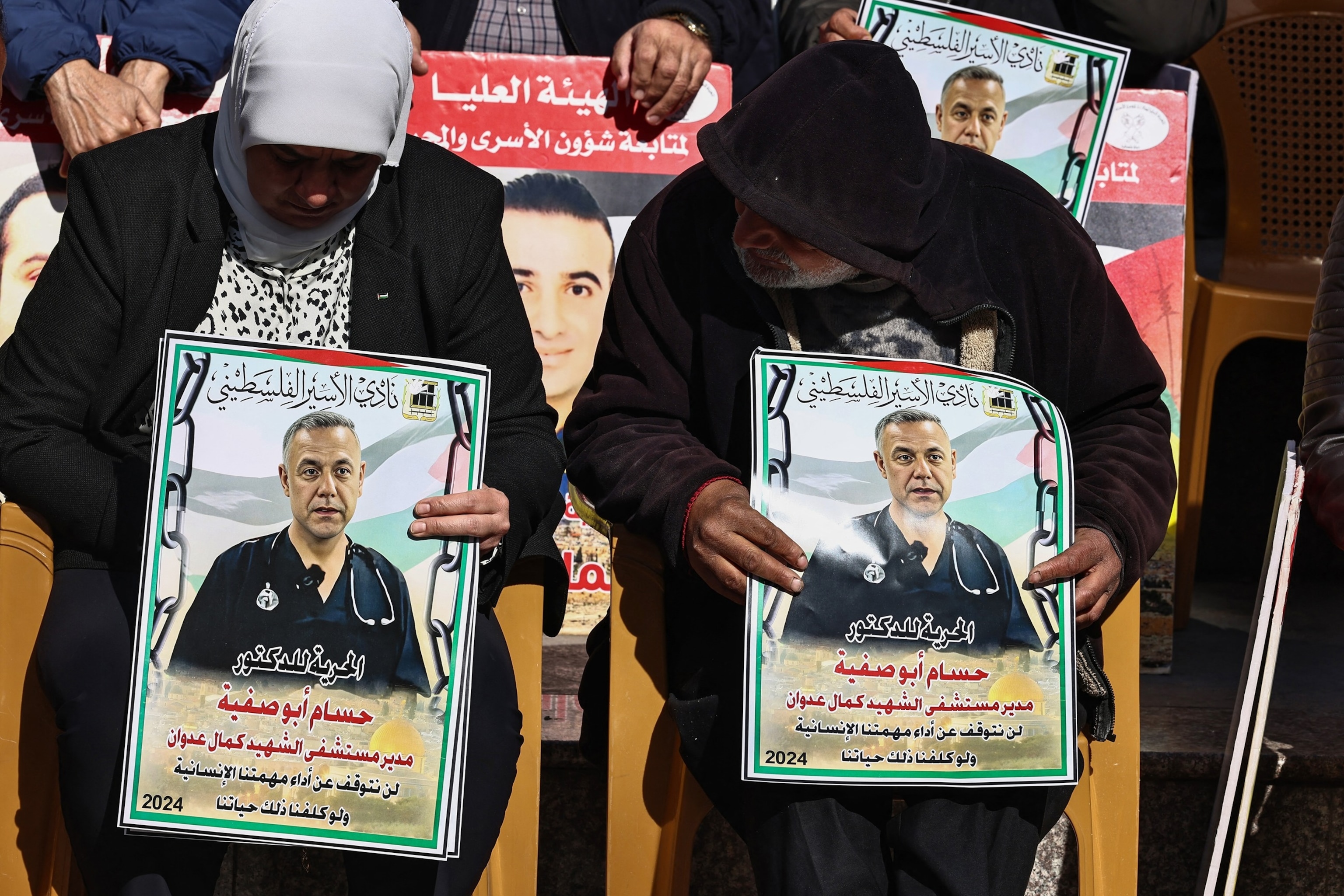 PHOTO: People lift placards bearing portraits of Palestinians currently detained by Israel, including the director of the Kamal Adwan Hospital in Gaza  Hussam Abu Safiya, during a protest in Ramallah city in the occupied West Bank on Jan. 14, 2025.