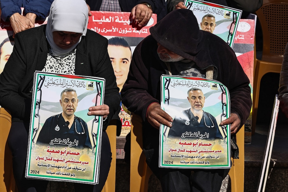 PHOTO: People lift placards bearing portraits of Palestinians currently detained by Israel, including the director of the Kamal Adwan Hospital in Gaza  Hussam Abu Safiya, during a protest in Ramallah city in the occupied West Bank on Jan. 14, 2025.