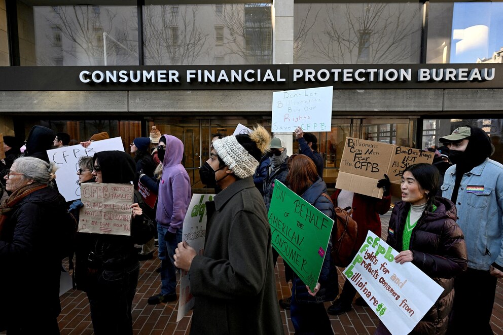 PHOTO: Supporters of the Consumer Financial Protection Bureau rally after acting CFPB Director Russell Vought told all of the agency's staff to stay away from the office and do no work, outside the CFPB in Washington, D.C., Feb. 10, 2025. 