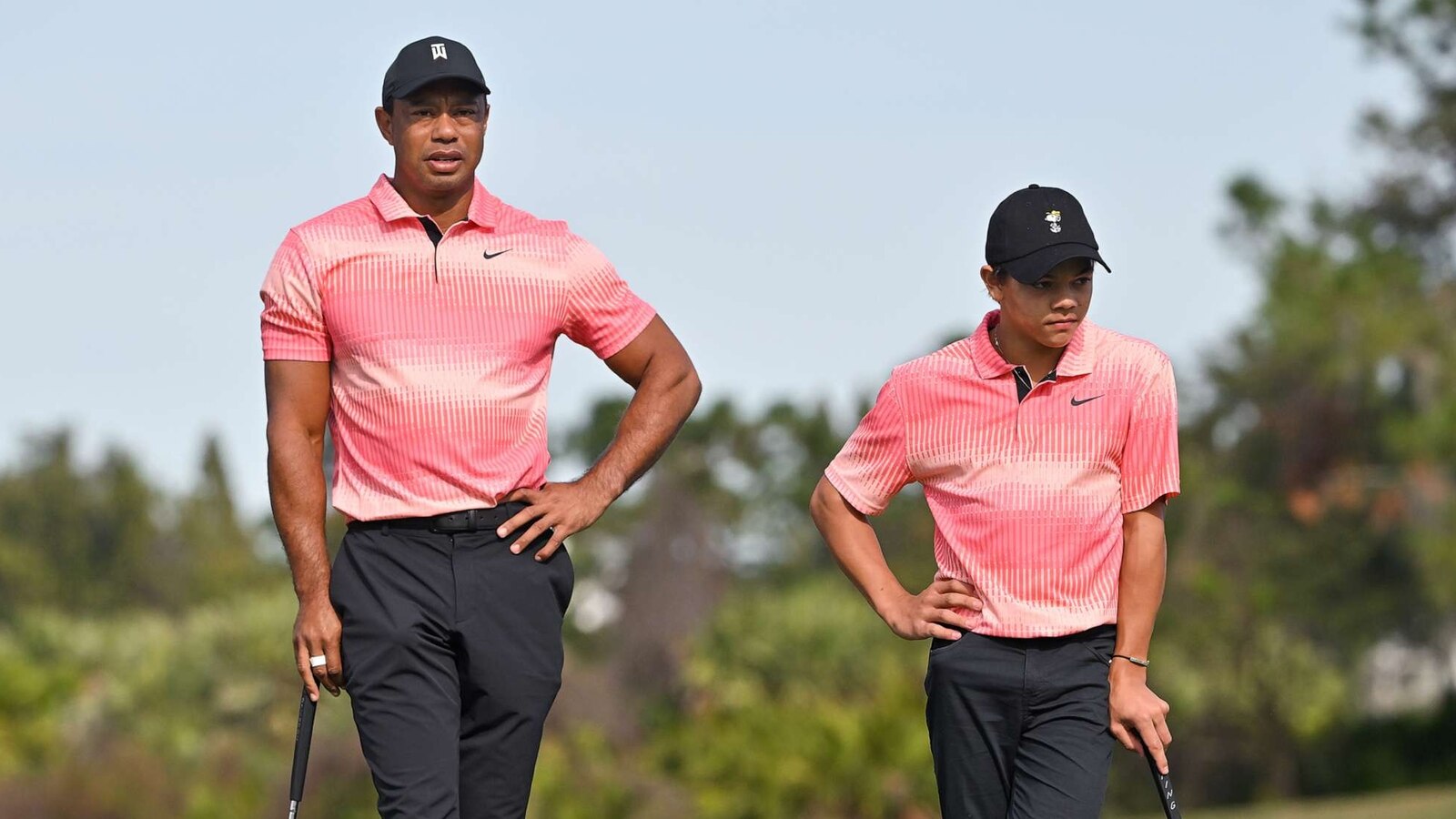 Star in the making Tiger Woods caddies for son Charlie at junior golf